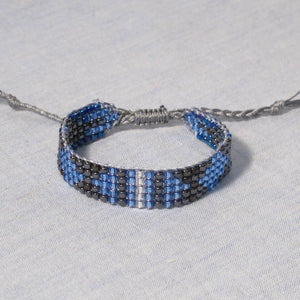 Blue, Black, Grey, White Bead Woven Bracelet with adjustable sliding macrame closure