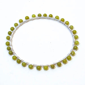 Silver bangle bracelet wrapped with green aventurine gemstones