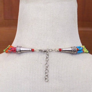 Color-Blocked Multi-Strand Beaded Necklace with silver cones and lobster claw clasp with extender chain