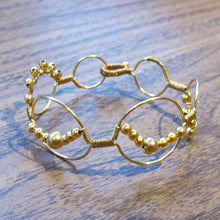Load image into Gallery viewer, Bead wrapped wire bracelet with matching metal beads, goldtone