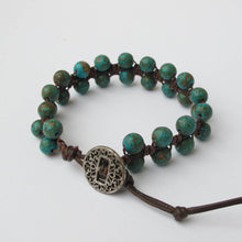 Load image into Gallery viewer, Double-Sided Macrame Bracelet with Turquoise Magnesite Gemstones and silver button closure