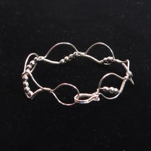 Load image into Gallery viewer, Silver hand-shaped wire bracelet with matching beads