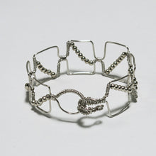 Load image into Gallery viewer, Silver hand-shaped wire bracelet with matching beads