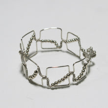Load image into Gallery viewer, Silver hand-shaped wire bracelet with matching beads