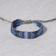Load image into Gallery viewer, Blue, Black, Grey, White Bead Woven Bracelet with adjustable sliding macrame closure