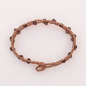 Copper hand-shaped wire bracelet with crystal beads