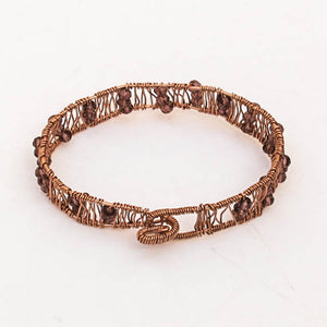 Copper hand-shaped wire bracelet with crystal beads
