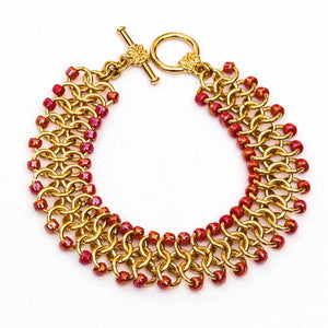 Gold Chain Maille Bracelet - European 4-in-1 Weave with Irridescent Fuschia Seed Beads and decorative gold toggle clasp