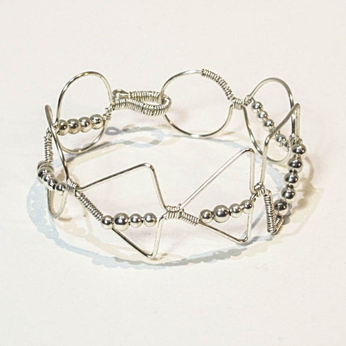 Silver hand-shaped wire bracelet with matching beads