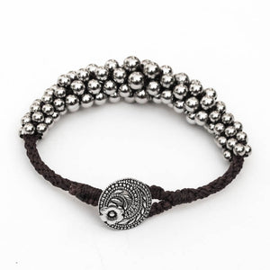 Black and Silver Kumihimo Bracelet with Graduated Metal Beads with silver button closure