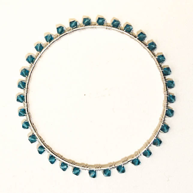 Silver bangle bracelet wrapped with turquoise Swarovski bicone crystal beads