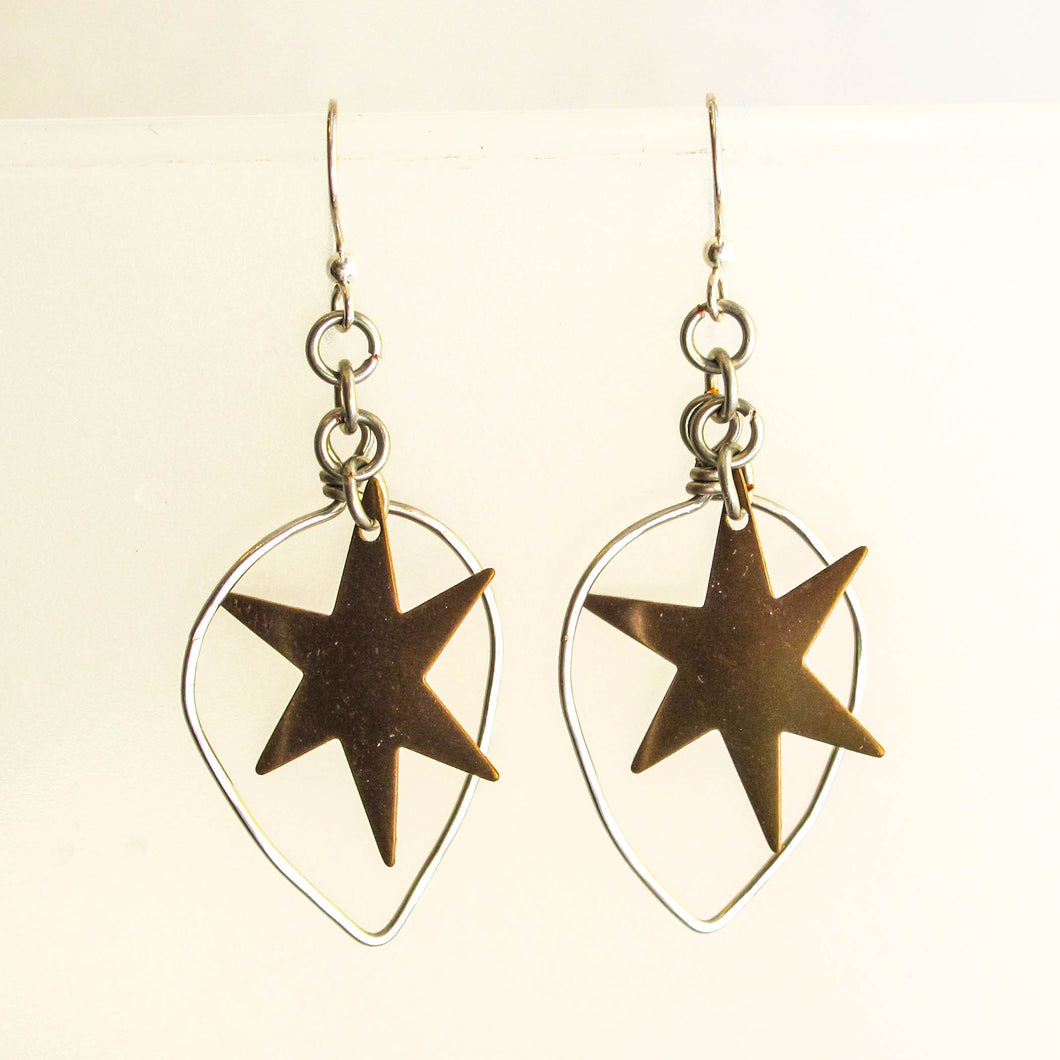 Hand shaped silver wire teardrop hoops with brass stars
