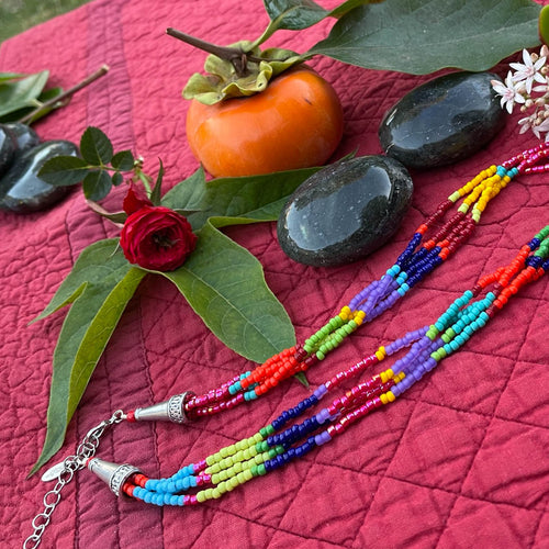 Color-Blocked Multi-Strand Beaded Necklace with silver cones and lobster claw clasp with extender chain