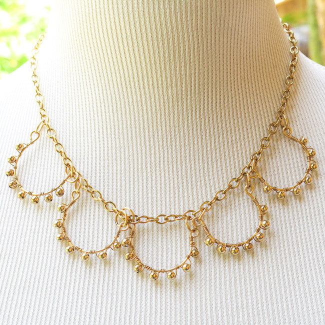 5-Loop Gold Necklace  wrapped with matching metal beads on gold chain