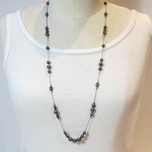 Floating Design Freshwater Pearl & Textured Metal Beads Necklace on gray silk cord