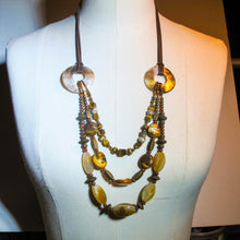Load image into Gallery viewer, Multi-Strand Antiquity Necklace with mixed brown beads and mother of pearl rings